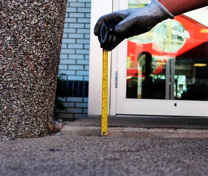 Commercial storefront entryway raised level after polyfoam concrete leveling