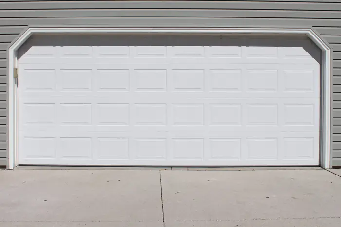 Garage apron slab settled away from the garage door before polyfoam lifting
