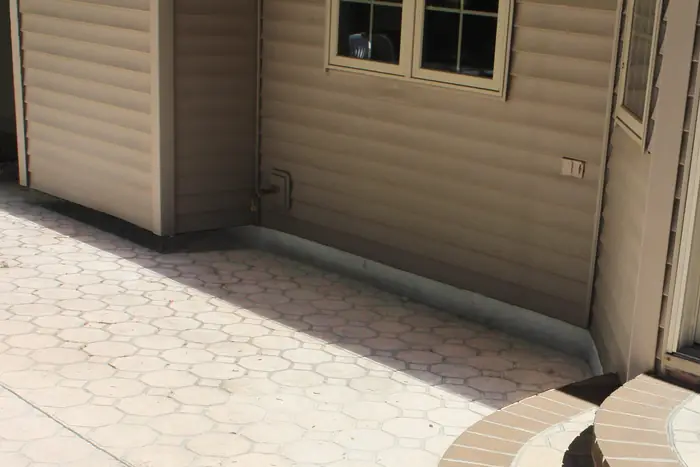 Paver patio settled toward the house before polyurethane foam lifting