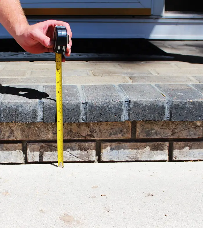 Front walkway raised back to the brick porch step after polyfoam concrete leveling
