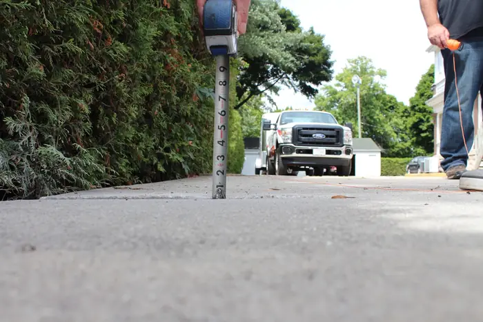 Sidewalk slab raised flush with its neighbor after polyfoam concrete leveling