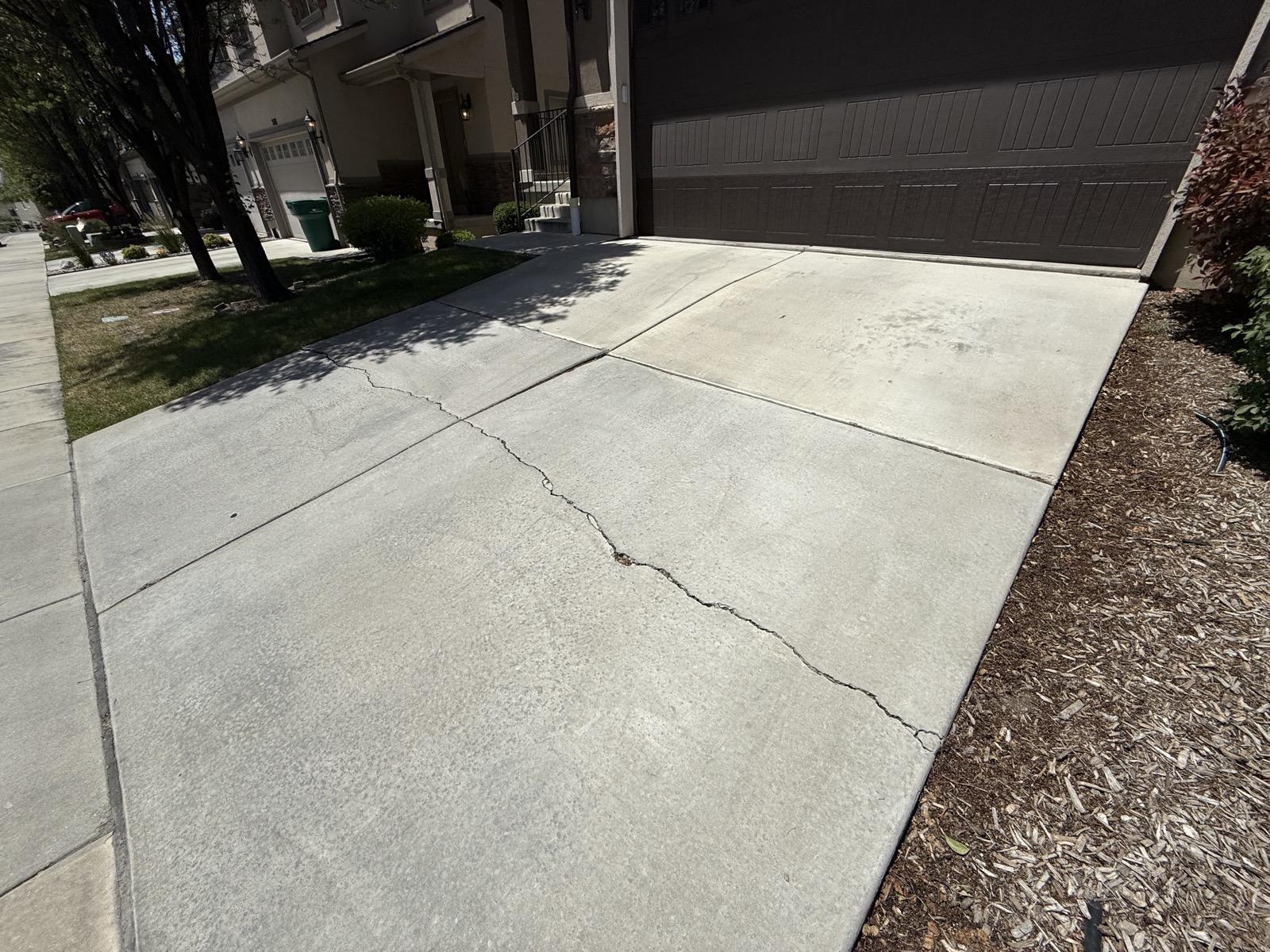 Cracked, settled driveway before polyfoam lifting, Lehi UT